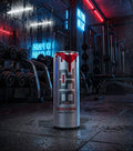 B 52. Energy drink on a gym floor with a neon sign that states "No Pain No Gain". 